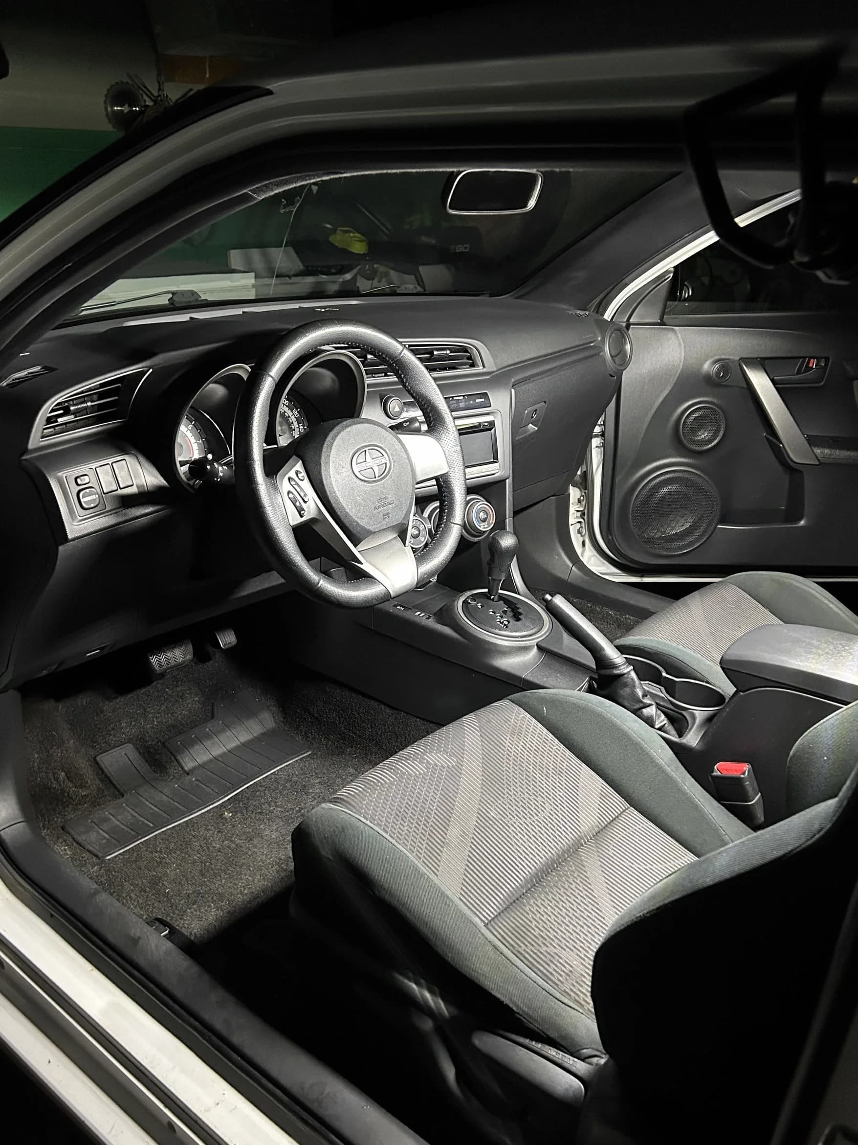 Clean black vehicle interior after detailing