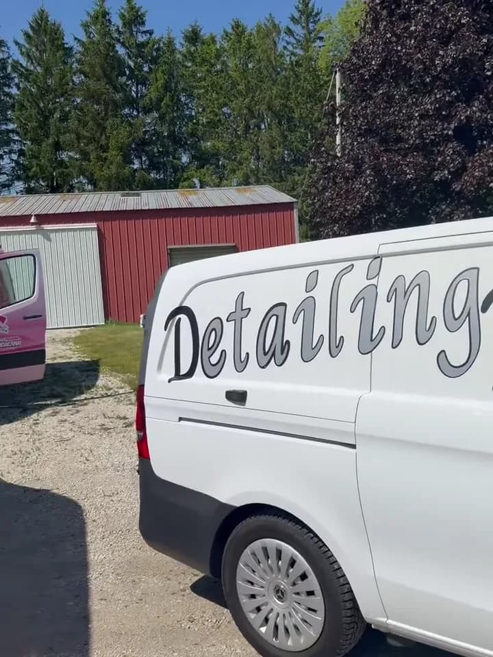 Detailing Rite mobile van beside a client work van