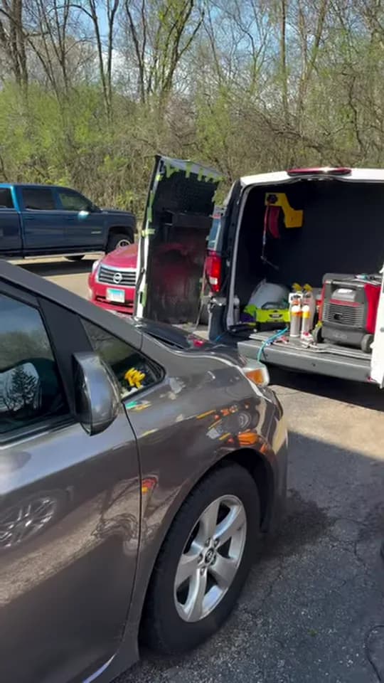 Detailing Rite setup working beside a Toyota Sienna